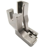 Metal sewing machine presser foot on a white background